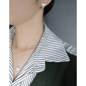 S925 silver heart jewelry set with engraved stars worn on model with necklace and earrings