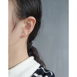 Minimalist S925 silver mushroom stud earrings with cubic zirconia stones on model