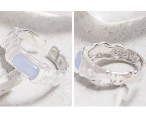 Detailed macro view showing the S925 hallmark and irregular hammered texture of the silver ring