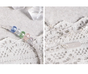 Macro detail of S925 sterling silver box chain with colorful faceted crystal beads