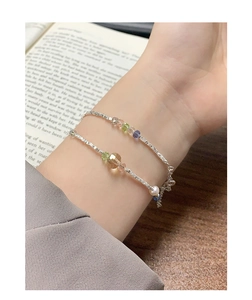 Detail of silver S925 bracelet set with colorful crystal beads and small white pearl
