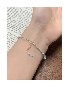 Close-up of S925 sterling silver bracelet with colorful crystal beads on a woman's wrist