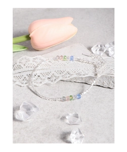 Detail of silver square link chain bracelet with multi-colored crystal beads and clasp