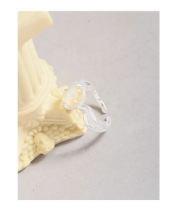 Close-up of S925 silver irregular cross ring with iridescent oval moonstone detail