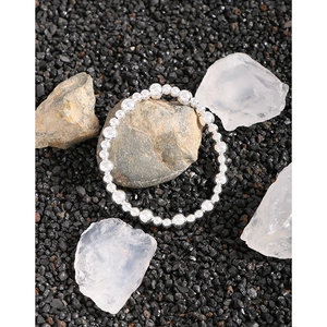 Polished S925 silver beaded bracelet for women on natural stone zen background