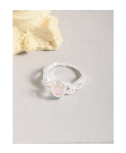 Macro detail of S925 sterling silver ring with irregular lines and moonstone inlay