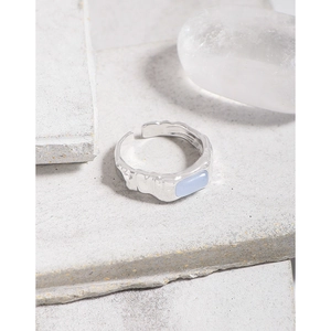 S925 silver irregular wrinkled ring with blue agate stone for women on grey stone background