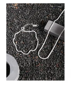 Macro detail of S925 sterling silver textured chain with sparkling crushed silver finish