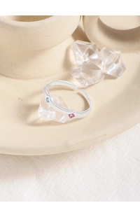 Close-up of S925 silver wavy ring featuring delicate pink and light blue zircon stones