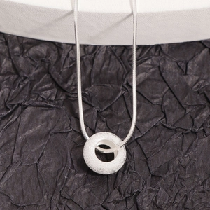 Minimalist S925 sterling silver doughnut necklace with glitter sand finish on flat snake chain
