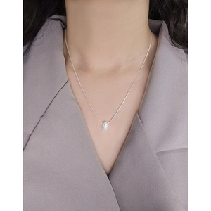 Elegant S925 sterling silver frosted doughnut necklace on model wearing grey suit