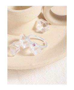 Detailed macro shot of an adjustable silver S925 ring with a square pink zircon stone