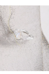 Macro detail of irregular S925 silver ring with iridescent moonstone and zircons