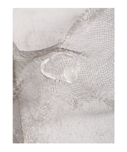 Macro detail of S925 sterling silver ring with moonstone and wavy adjustable band