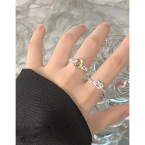 S925 silver irregular rings with yellow moonstone and twisted knot design on model