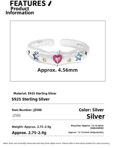 Macro detail of S925 sterling silver ring with heart pink stone and blue star gems