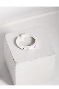 Macro shot of S925 sterling silver ring with blue star and pink heart zircon stones