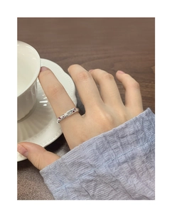 Detail of S925 silver ring with micro-inset zircons and retro floral patterns