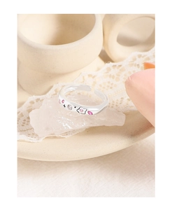 Detail of S925 silver adjustable ring with pink enamel flowers and zircon accents