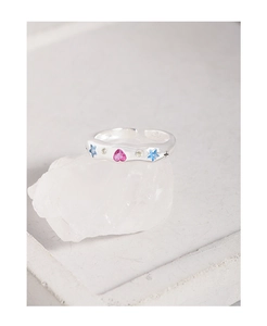 Detail of S925 silver open ring featuring pink heart and blue star zircon stones