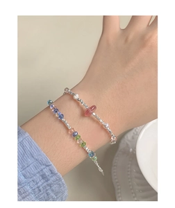 Close-up of S925 silver bracelet with faceted colorful crystal beads and white pearls