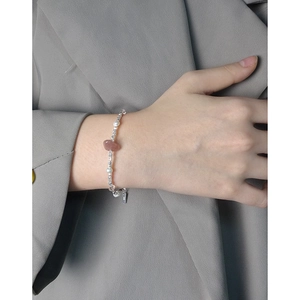 Elegant S925 sterling silver bracelet with strawberry quartz and pearls on model wrist