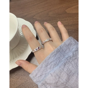 S925 sterling silver rings with colorful zircon inlays shown on a wooden table