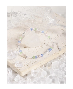 Detailed macro of S925 sterling silver tag on a colorful crystal beaded bracelet