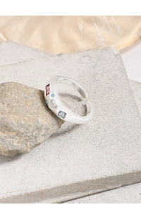 Close-up of S925 sterling silver ring with multi-colored gemstones in various shapes