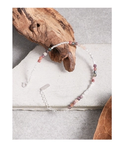 Macro shot of S925 silver clasp and colorful tourmaline beads on an adjustable bracelet