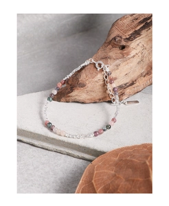Artistic close-up of S925 sterling silver bracelet with multi-color tourmaline beads