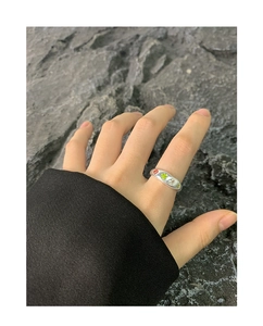 Detail of S925 silver ring featuring colorful zircon stones and irregular lava texture