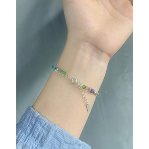 S925 sterling silver bracelet featuring colorful crystal beads and adjustable chain on wrist