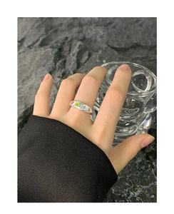 Detail of S925 silver wide ring featuring heart-shaped green zircon and colorful gems