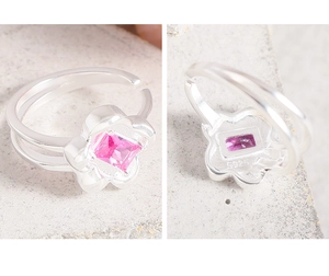 Detailed macro view of S925 sterling silver ring with pink zircon flower and hallmark