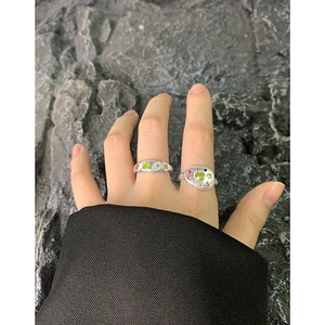 Vintage S925 silver rings with colorful zircon gemstones on industrial stone background