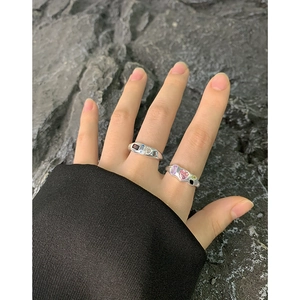 S925 silver open rings set with colorful zircons on dark textured rock background