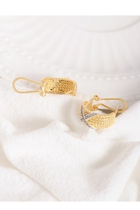 Macro view of S925 silver twist earrings with gold plating and zircon inlay detail