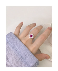 Detail of S925 silver ring featuring a rose zircon flower design on the finger