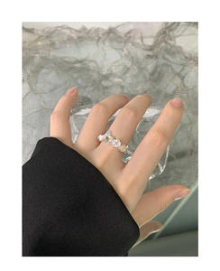 Detailed view of S925 silver ring featuring heart moonstone and pink flower bow