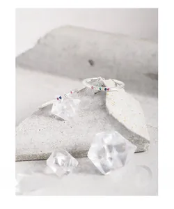 Detailed shot of S925 sterling silver rings featuring colorful zircon stones inlay