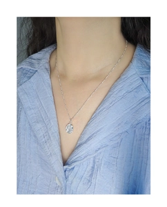 Close-up of S925 sterling silver necklace with irregular hammered texture on model