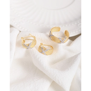 Elegant gold woven mesh earrings and ring set with crisscross diamond accents on fabric