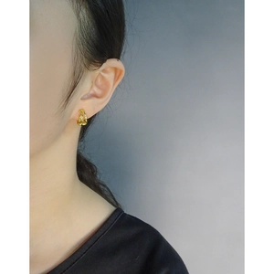 Elegant gold S925 silver cross line earrings for women shown on a fashion model
