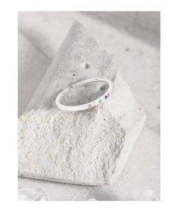Macro shot of silver S925 open ring featuring micro-set colorful rainbow zircon stones