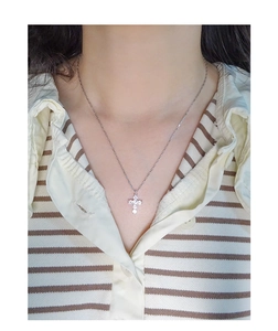 Close-up of S925 sterling silver cross pendant necklace with sparkling cubic zirconia