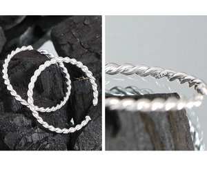 Detail of S925 sterling silver twisted rope ring with a close-up of the hallmark