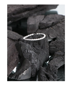 Detailed view of S925 sterling silver open ring with classic braided twist texture