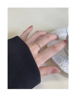 Close-up of S925 sterling silver twisted rope ring worn elegantly on finger