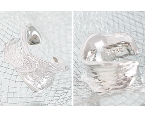 Detail of S925 sterling silver ear cuff with irregular lava texture and hallmark